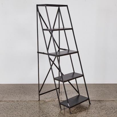 A Foldable Black Metal Industrial Ladder