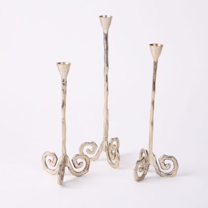 A Trio of Cast Candlesticks