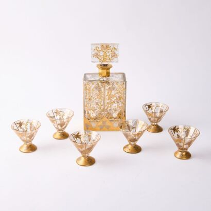 A Set of Royal Crystal Czechoslovakia finished in 22ct gold Glasses and Decanter