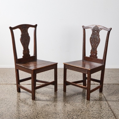 A Pair of Ornate Backed Antique Chairs