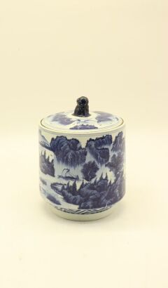 A Chinese Jingdezhen blue and white 'landscape' tea tin with beast button