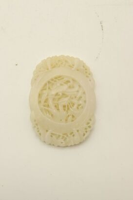 A Chinese 20th century reticulated white jade ' dragons' oval pendant