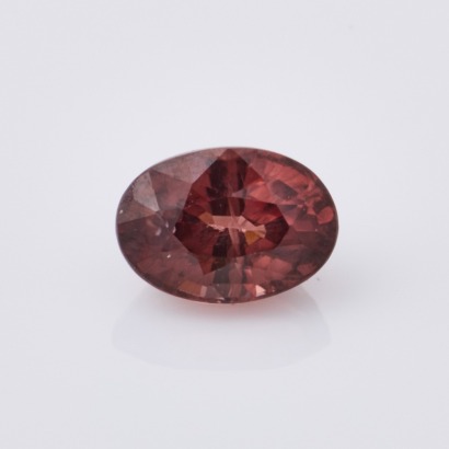 A Loose 1.61ct, Oval Mixed Cut, Pink - Brown Zircon