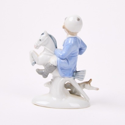 A European Boy on Toy Horse Ceramic Ornament.