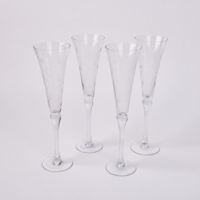 A Set Of Four Elegant Bubble Etched Champagne Flutes