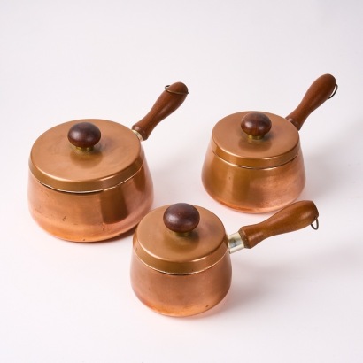 A Set of Three Mid-Century Copper and Stainless Steel Saucepans