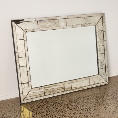 A Large Wall Mirror with Distressed Bordering