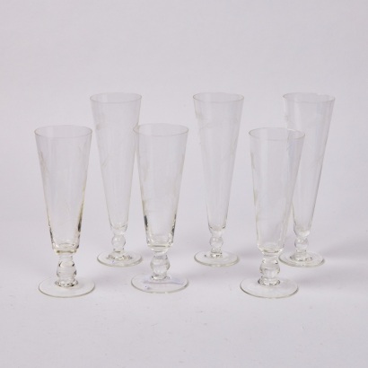 A Collection of Six Etched Glass Flutes