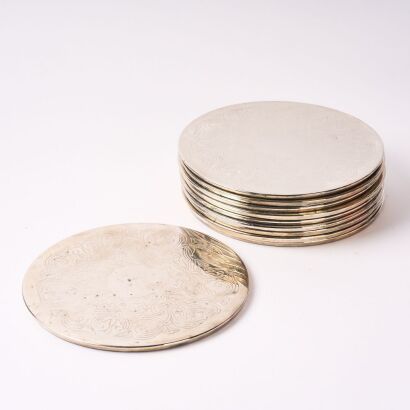 A Set of Ten Decorative Silver Plate Coasters