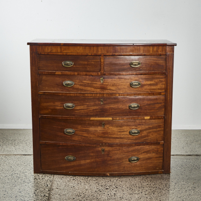 A Walnut Bow Front Chest