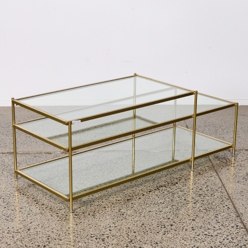 A Contemporary Three Tread Glass Topped Coffee Table