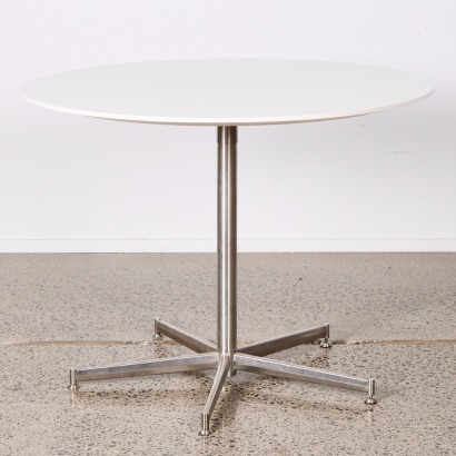 An Eames Style Circular Table With Stainless Base