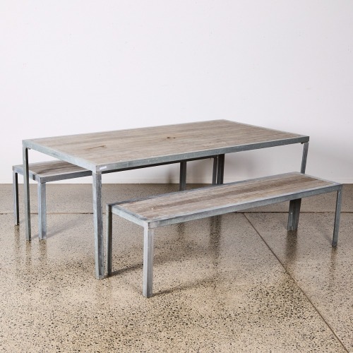 A Michael Draper Outdoor Dining Table and Two Bench Seats