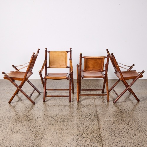 A Set Of Four Trendsetter Campaign Leather Chairs