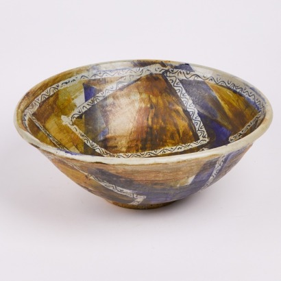 A Large Patchwork Glazed Ceramic Bowl