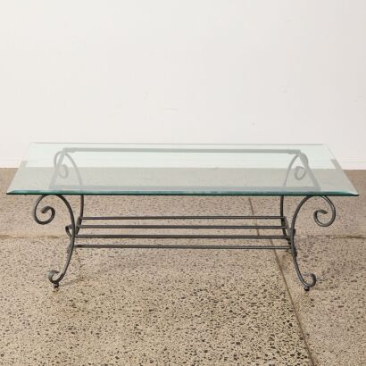 A Wrought Iron Coffee Table With Bevelled Edged Glass Top