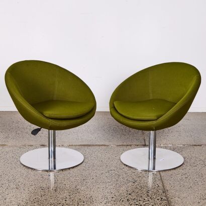 A Pair of Green Upholstered Swivel Chairs