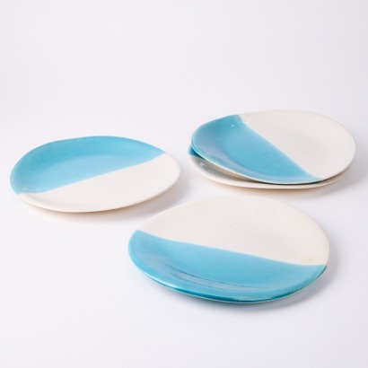 A Set of Four Glazed Plates by Marisol Lambercy