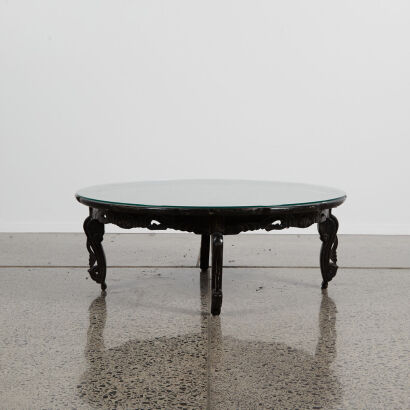 A Chinese Black Lacquered Shell-Inlaid 'Floral' Rounded Table with glass top