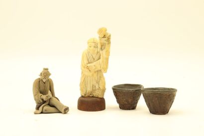 A Chinese small bone figures and A small pottery figures and Two small cups