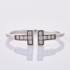 Tiffany & Co, 18ct White Gold, .13ct Tiffany "T" Diamond Ring