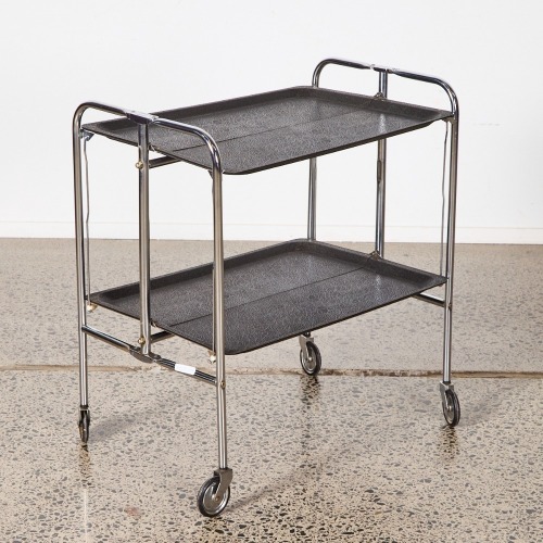 A Retro Folding Chrome And Black Plastic Trolley