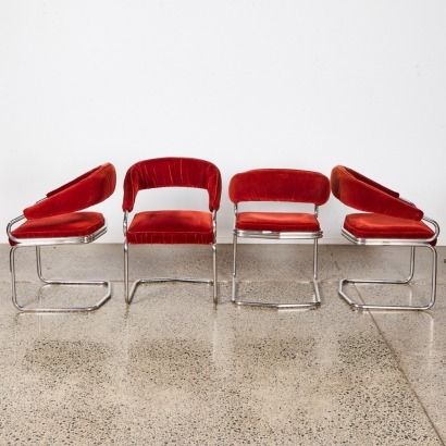 A Set Of Four Retro Burgundy Upholstered Cantilever Chairs