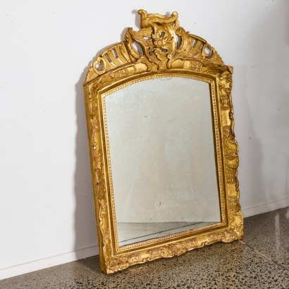 A Gilded Wood And Plaster Mirror