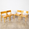 A Suite Of 4 Designer Chairs In Oak