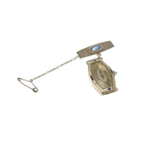 A Lady's Art Deco pendant watch, circa 1920's. Manual. Barrel shaped case, silvered dial, Arabic numerals, diamond and calibre sapphire set bezel. 17 jewel Swiss movement and 18ct yellow and white gold.&nbsp;