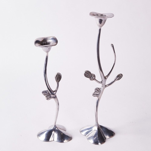 A Graduated Pair of Aluminum Candlesticks by Mathew Von Sturmer