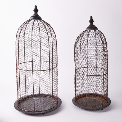 A Pair of Metal Wire Cloches' on Footed Metal Stands