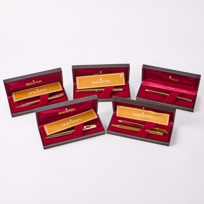 A Collection of Five Gold Sheaffer Pens