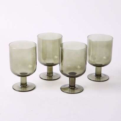 A Set Of Four Smokey Grey Hand blown Wine Glasses