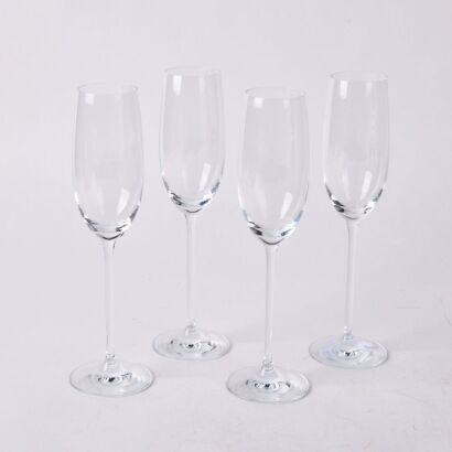 A Set Of Four Tall Crystal Champagne Flutes