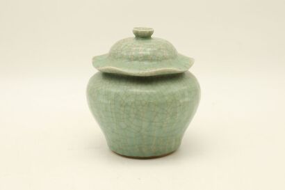 A Chinese Celadon Lotus-shaped Lidded Jar