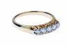 A diamond bridge ring, set five across with round modern brilliant cut diamonds. Estimated total diamond weight 0.45 carat. 18ct yellow gold. Weight 4.50 grams. Size O&frac12;.
