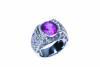 A tourmaline and diamond ring, the central oval pink tourmaline in a pave diamond and tourmaline set mount. 18ct white gold. Weight 12.6 grams. Size L.