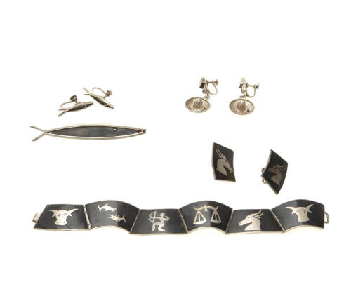 A collection of Mexican silver jewellery including a necklace, earrings and brooch.