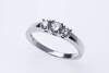 A diamond ring, set three across with graduated round modern brilliant cut diamonds of estimated total diamond weight 0.35 carat. 18ct white gold. Weight 4.54 grams. Size O.