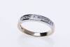 A diamond eternity ring, channel set with ten princess cut diamonds of total estimated weight 0.50 carat. 9ct yellow and white gold. Weight 2.74 grams. Size O.