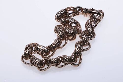 A gold bracelet, of pierced oval link design. 9ct rose gold. Weight 13.12 grams. Length 19.5cm.