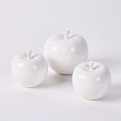 A Collection of Three Decorative White Ceramic Apples