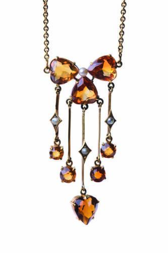 An Edwardian citrine and seed pearl pendant necklace. 9ct yellow gold. Weight 6.6 grams. Length 42cm.