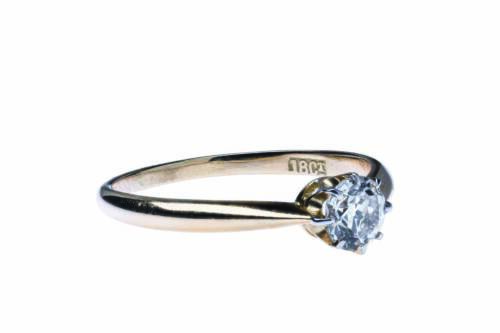 A solitaire diamond ring, claw set with an old European cut diamond of estimated weight 0.44 carat. 18ct yellow gold. Weight 2 grams. Size P.&nbsp;