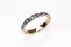A white sapphire eternity ring, set all around with round brilliant sapphires. 18ct yellow gold and platinum. Weight 4 grams.