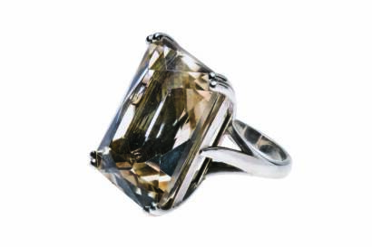 A smoky quartz cocktail ring, four claw set with a rectangular fancy cut smoky quartz of estimated weight 40.74 carats. Sterling Silver. Weight 15.69 grams. Size N½.