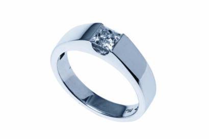 A solitaire diamond ring, the plain polished band set with a princess cut diamond of estimated weight 0.45 carat. 18ct white gold. Weight 6.32 grams. Size O.