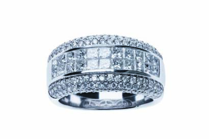 A diamond band ring, the wide band set with a central panel of twenty-two princess cut diamonds, within a pave diamond surround. 18ct white gold. Weight 12.09 grams. Size N.