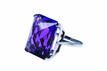 An amethyst ring, four claw set with a rectangular fancy cut amethyst of estimated 21.12 carats. 9ct white gold. Weight 8.14 grams. Size L.